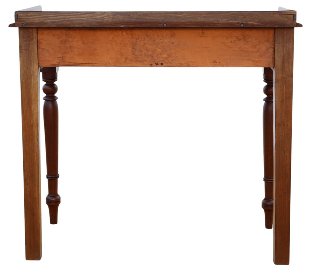A 19th-century mahogany writing table featuring a gallery top, two frieze drawers with wooden knob handles, and turned legs. View VII