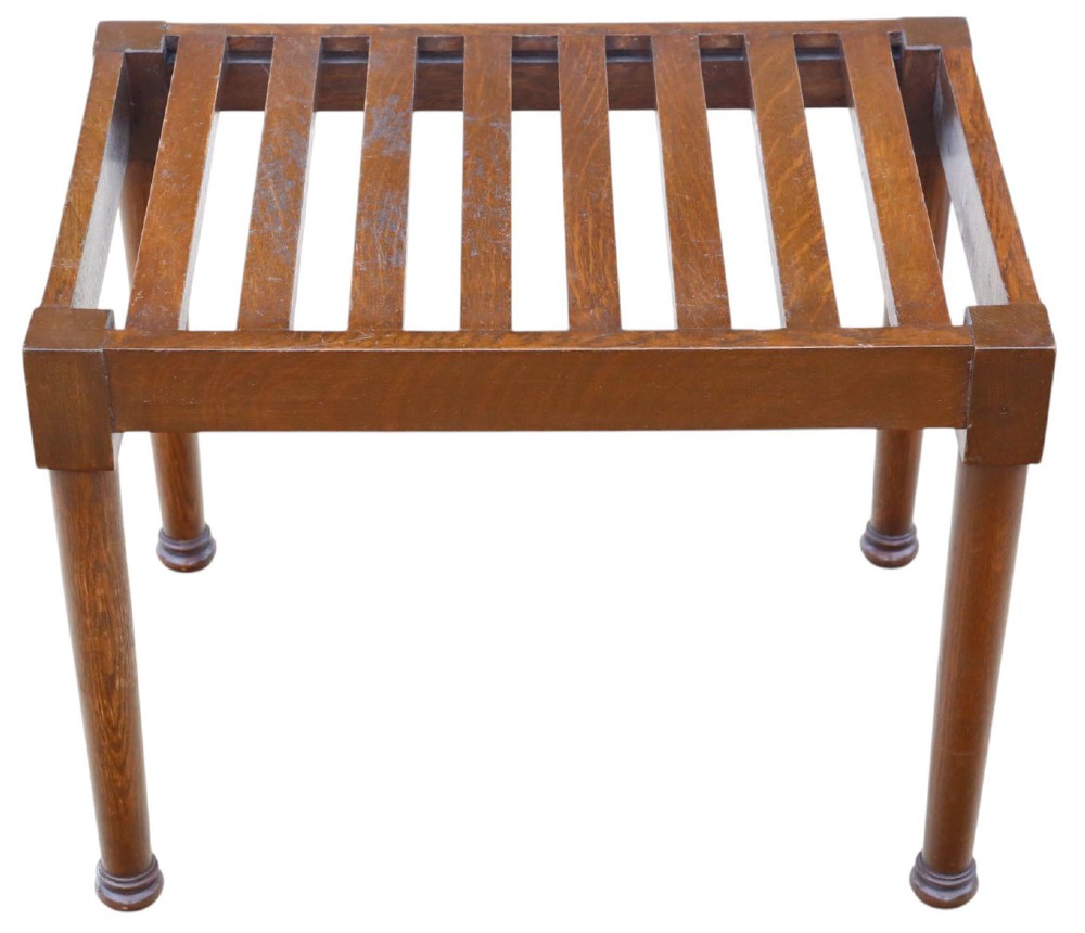 An antique mahogany luggage stand featuring a slatted timber top and four turned legs with collared feet. View III