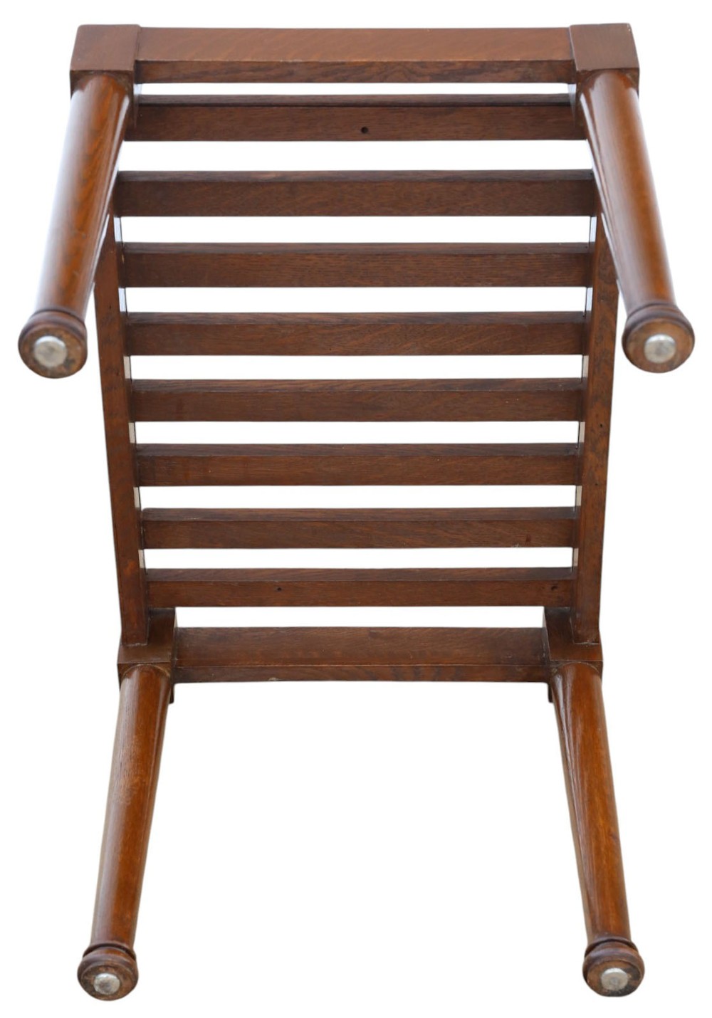 An antique mahogany luggage stand featuring a slatted timber top and four turned legs with collared feet. View IV