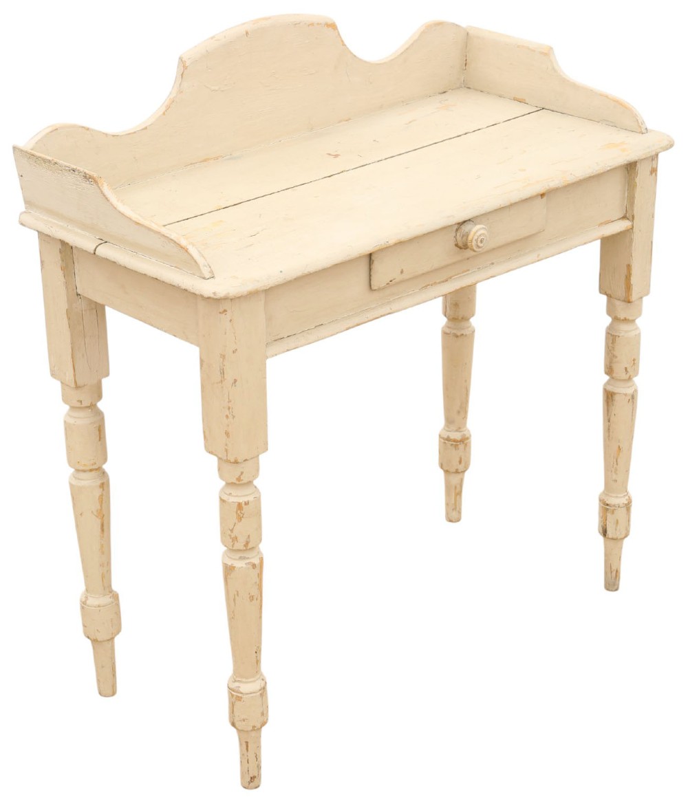 A 19th-century cream painted wooden writing table featuring a shaped gallery back, turned legs, and a single central drawer with a turned wooden knob. View III