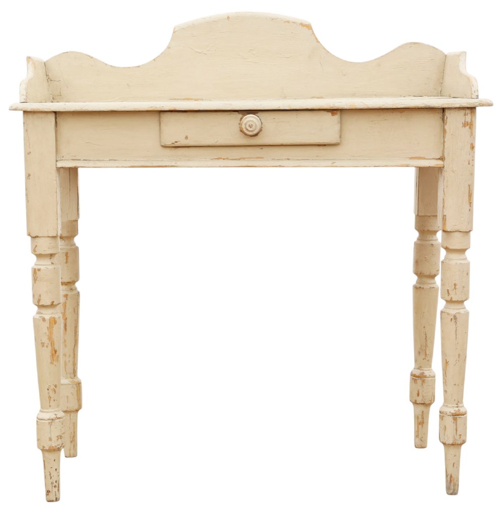 A 19th-century cream painted wooden writing table featuring a shaped gallery back, turned legs, and a single central drawer with a turned wooden knob. View IV