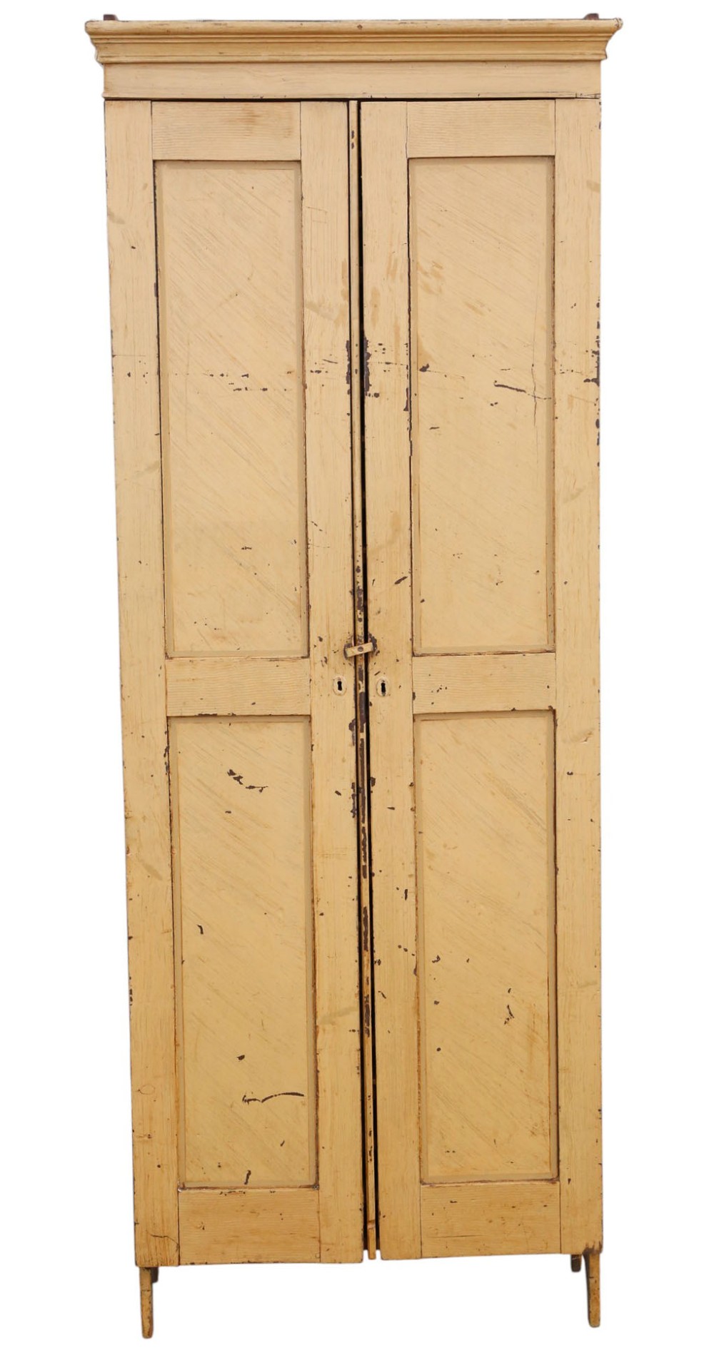 A tall, narrow 19th-century cream painted pine housekeepers cupboard featuring double panelled doors, a moulded top cornice, and distressed paintwork.
