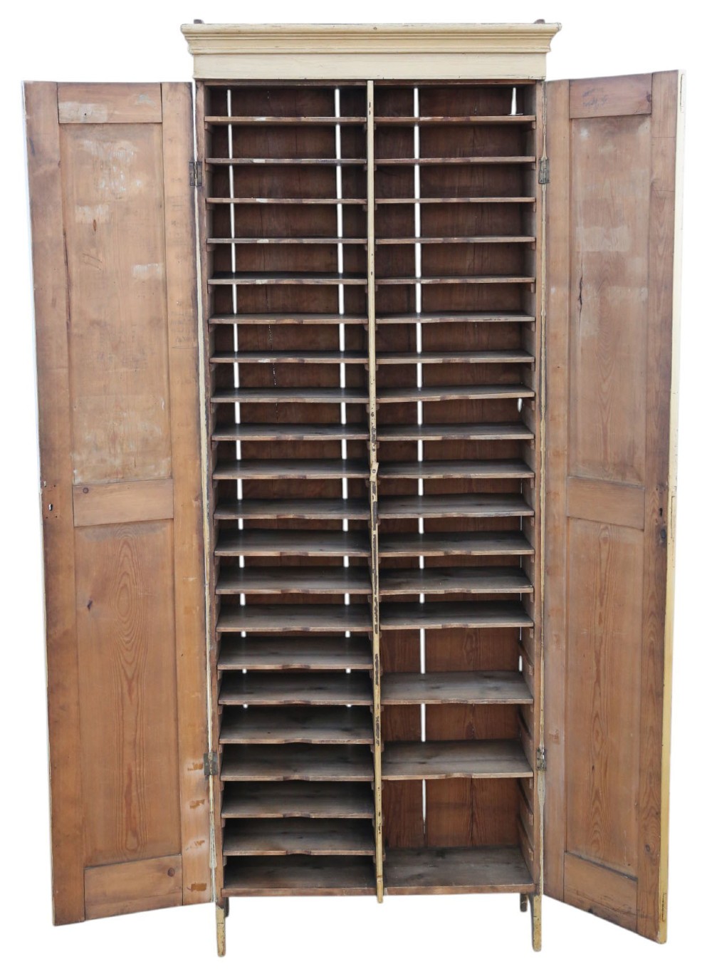 A tall, narrow 19th-century cream painted pine housekeepers cupboard featuring double panelled doors, a moulded top cornice, and distressed paintwork. View II