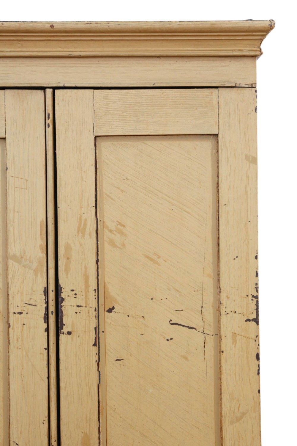 A tall, narrow 19th-century cream painted pine housekeepers cupboard featuring double panelled doors, a moulded top cornice, and distressed paintwork. View IV
