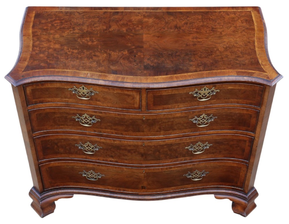 A serpentine-front burr walnut chest of drawers featuring crossbanded borders, cast brass handles, and ogee bracket feet. View III