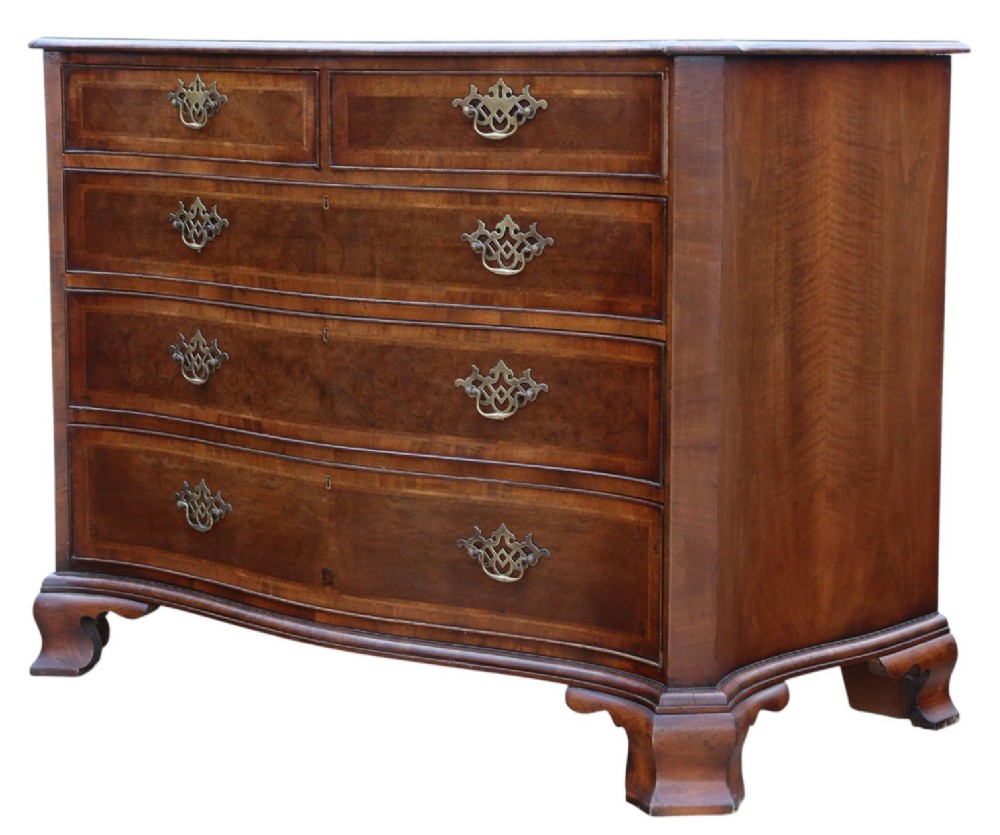 A serpentine-front burr walnut chest of drawers featuring crossbanded borders, cast brass handles, and ogee bracket feet. View IV