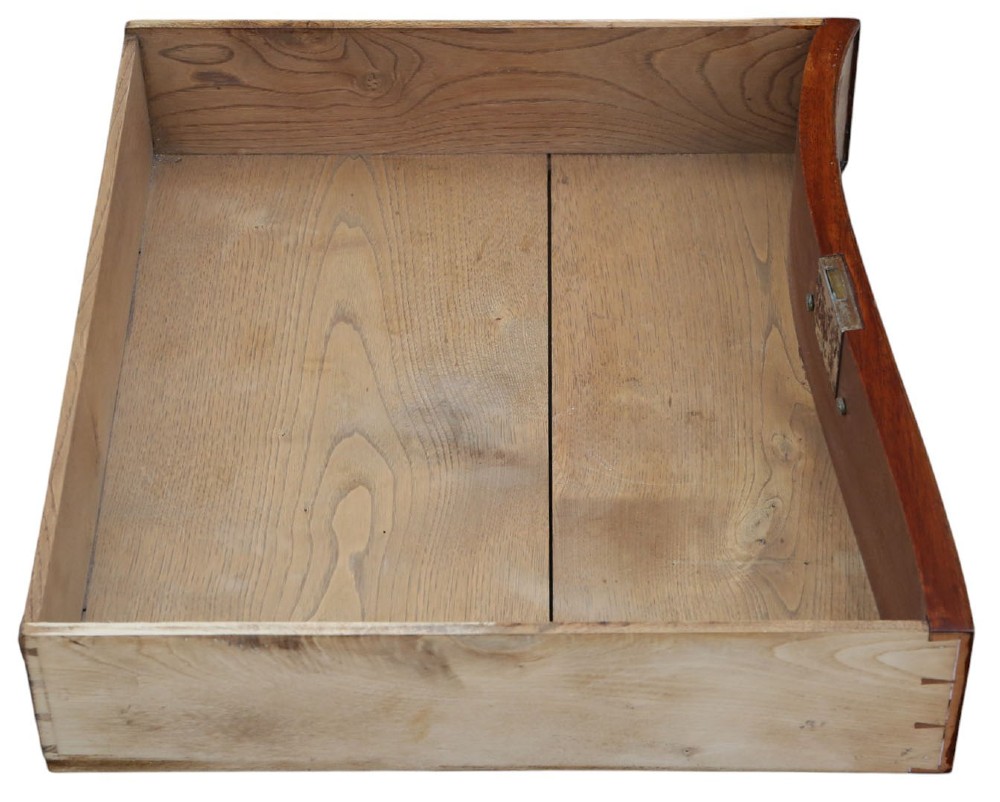 A serpentine-front burr walnut chest of drawers featuring crossbanded borders, cast brass handles, and ogee bracket feet. View VII