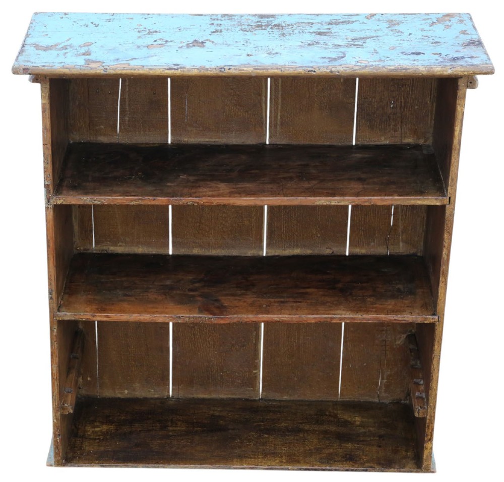 A 19th-century rustic open-front wooden bookcase with distressed light blue paint on the exterior and dark stained wood interior shelves. View IV