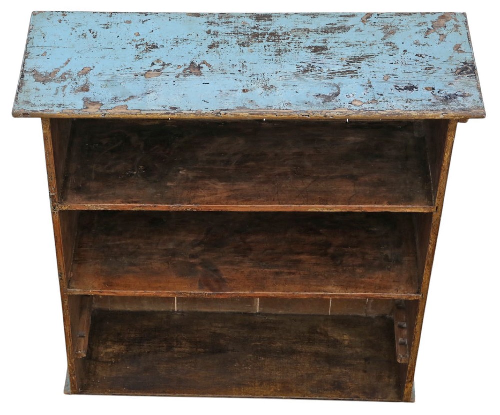 A 19th-century rustic open-front wooden bookcase with distressed light blue paint on the exterior and dark stained wood interior shelves. View V