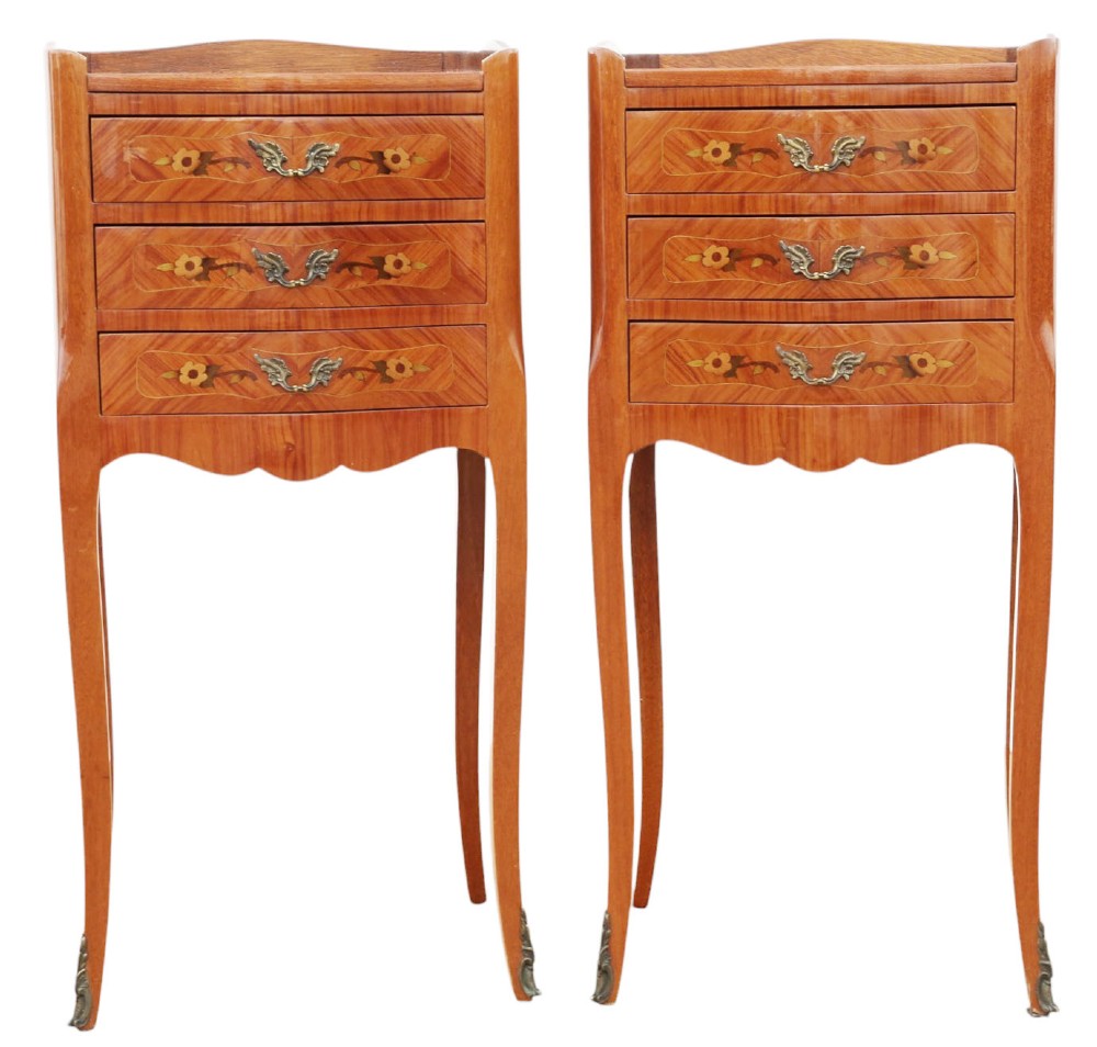 A pair of slim French style bedside tables featuring floral marquetry wood inlays, three drawers with brass handles, and slender cabriole legs. View II