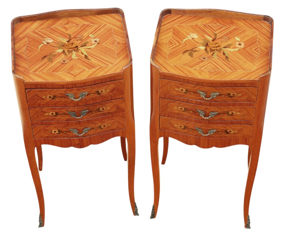 A pair of slim French style bedside tables featuring floral marquetry wood inlays, three drawers with brass handles, and slender cabriole legs. View III