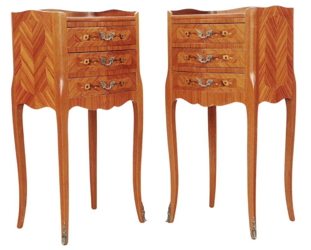 A pair of slim French style bedside tables featuring floral marquetry wood inlays, three drawers with brass handles, and slender cabriole legs. View IV