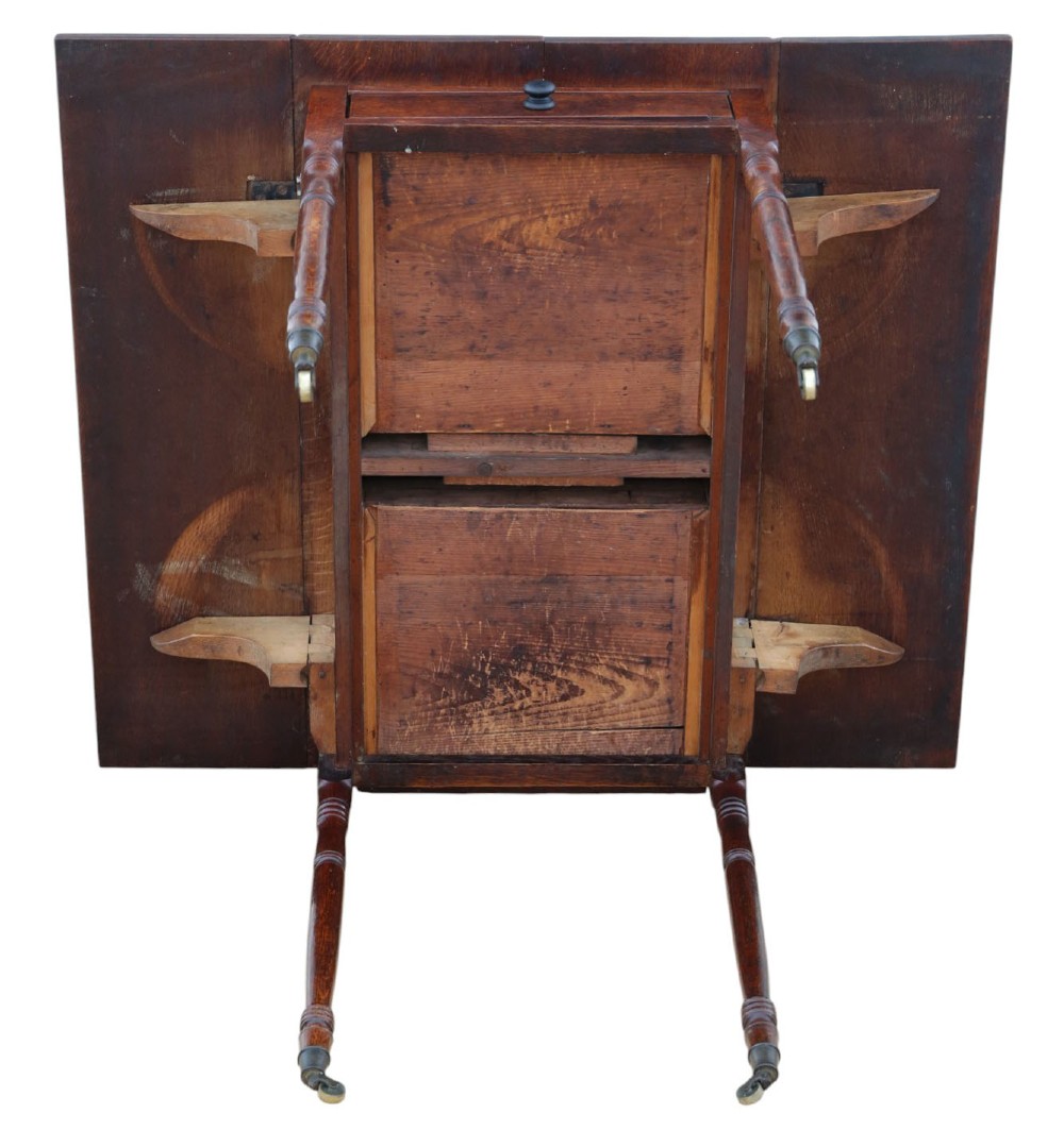 A Georgian oak drop-leaf Pembroke table featuring turned legs, a single end drawer, and brass castors. View VIII