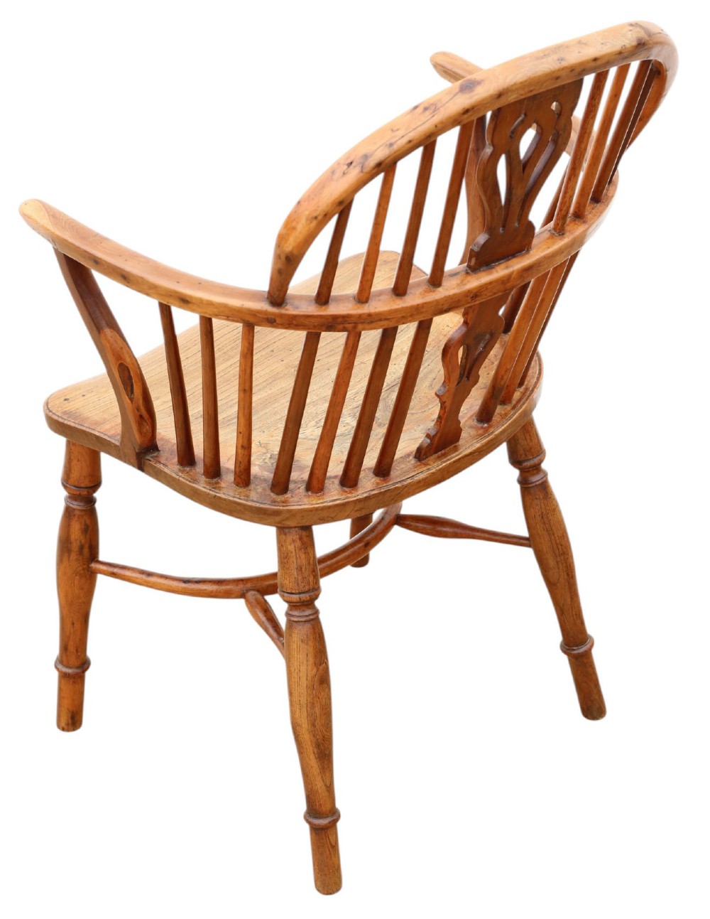 A 19th-century yew and elm Windsor armchair featuring a hoop back, pierced central splat, turned legs, and a crinoline stretcher. View III