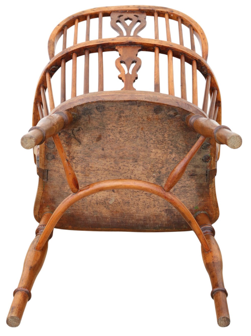A 19th-century yew and elm Windsor armchair featuring a hoop back, pierced central splat, turned legs, and a crinoline stretcher. View VI