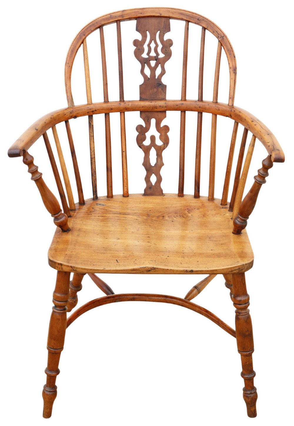 A nineteenth-century wooden Windsor armchair featuring a curved hoop back, a decorative central splat, shaped elm seat, and turned legs with a crinoline stretcher.