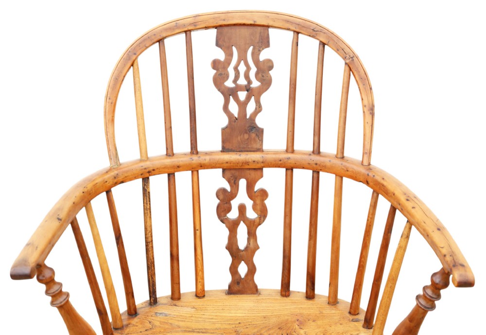 A nineteenth-century wooden Windsor armchair featuring a curved hoop back, a decorative central splat, shaped elm seat, and turned legs with a crinoline stretcher. View IV