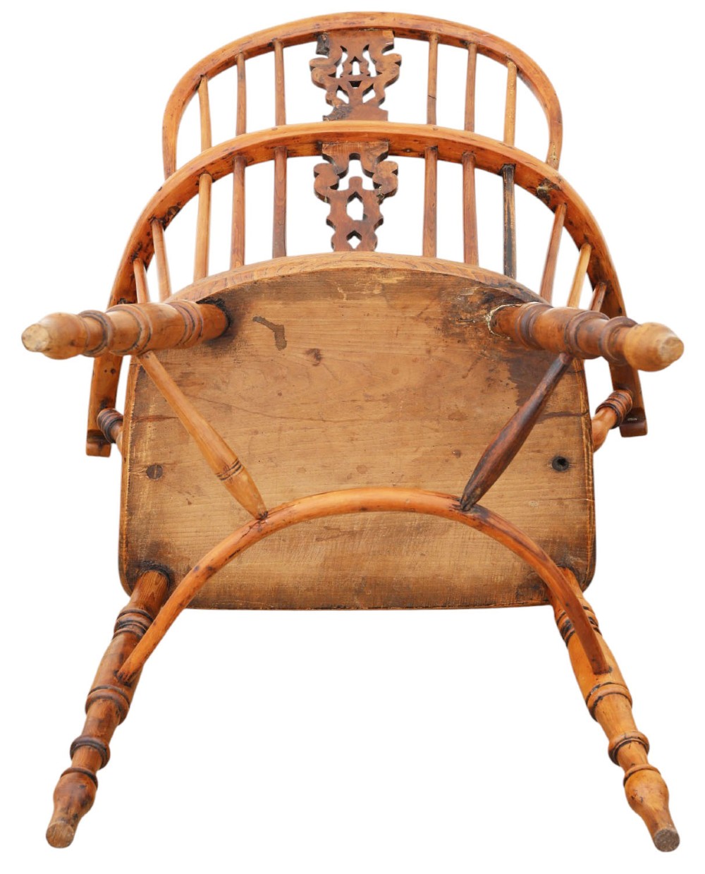 A nineteenth-century wooden Windsor armchair featuring a curved hoop back, a decorative central splat, shaped elm seat, and turned legs with a crinoline stretcher. View VII
