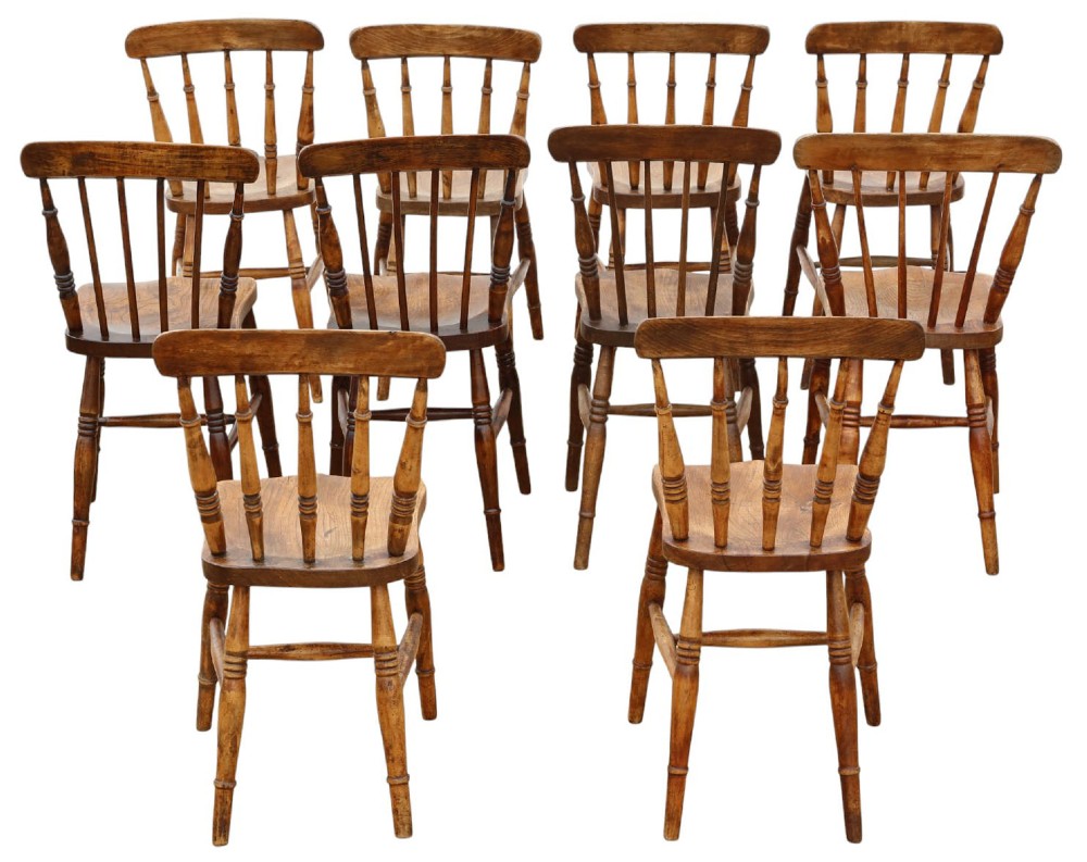 A harlequin set of ten 19th-century Victorian dining chairs crafted from elm and beech wood, featuring spindle backs, curved top rails, turned legs, and stretchers. View II