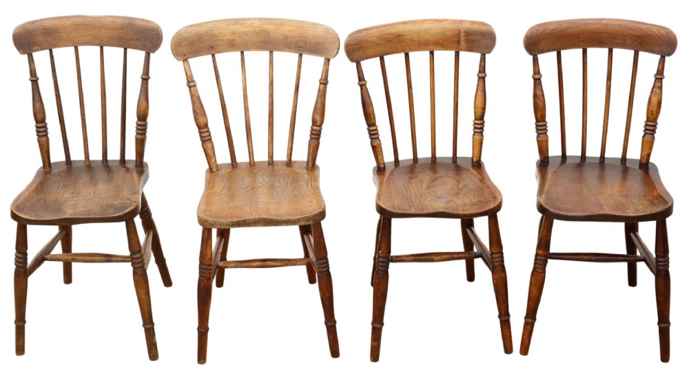 A harlequin set of ten 19th-century Victorian dining chairs crafted from elm and beech wood, featuring spindle backs, curved top rails, turned legs, and stretchers. View VIII