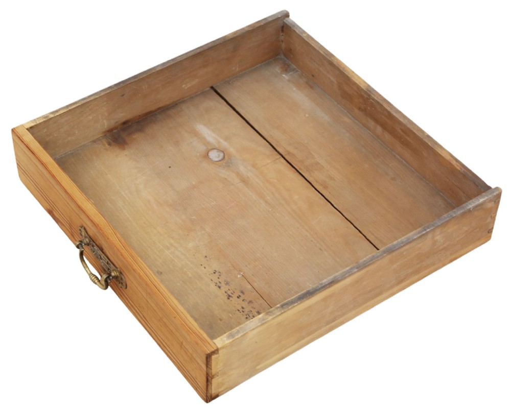 A 19th-century pitch pine writing table with two drawers, brass handles, turned legs, and metal castors. View IV