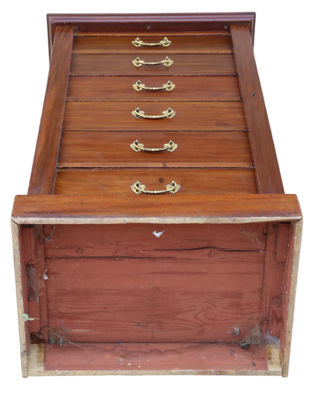 A tall mahogany Wellington chest featuring six drawers with brass handles and a right-side locking pilaster on a plinth base. View VII