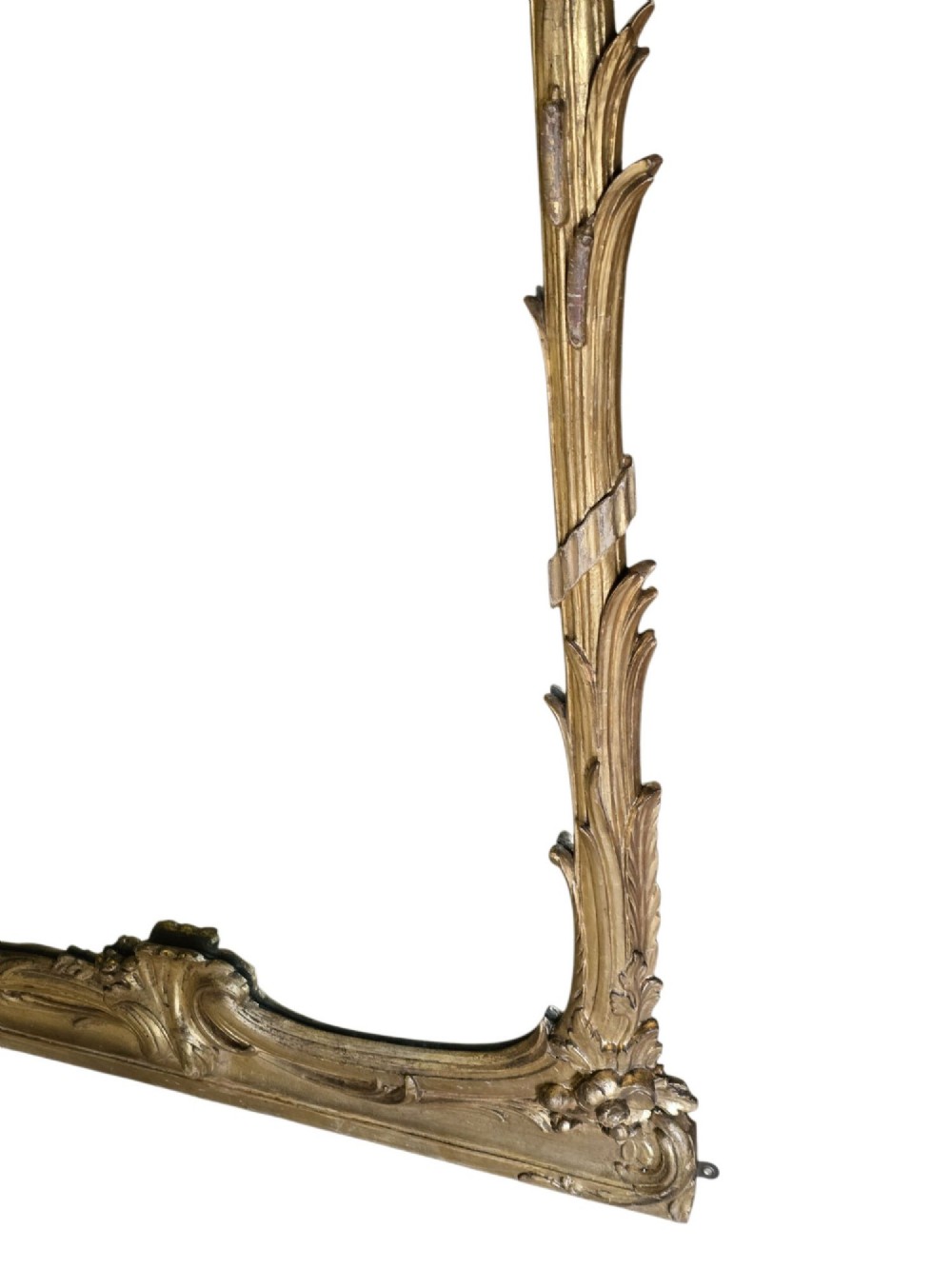 A large 19th-century tall wall mirror featuring an ornate gilded wood frame with hand-carved acanthus leaf cresting and scrollwork. View VI