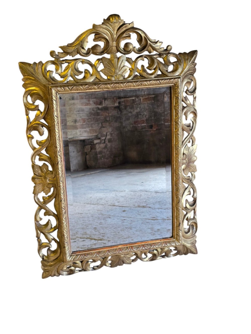 A rectangular 19th-century Florentine wall mirror featuring a carved openwork giltwood frame with scrolling acanthus leaves. View II