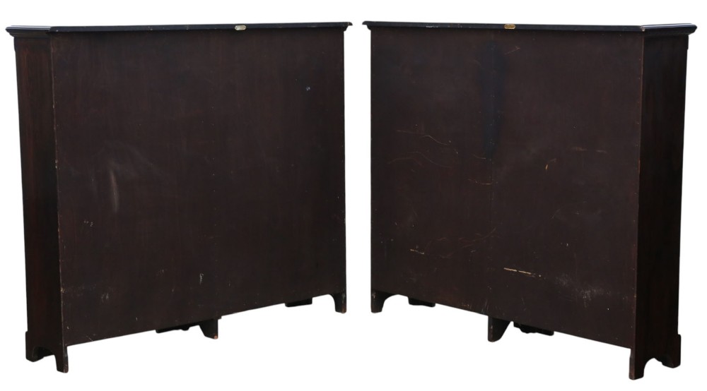 A matching pair of dark oak double-bay bookcases featuring fluted vertical trim, adjustable shelving, green pattern-lined interiors, and bracket bases. View VII