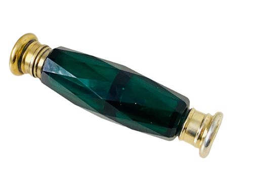 fig 1. An antique Victorian double-ended scent bottle made from faceted emerald green glass with brass caps at each end.