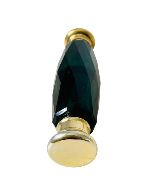fig 2. An antique Victorian double-ended scent bottle made from faceted emerald green glass with brass caps at each end.