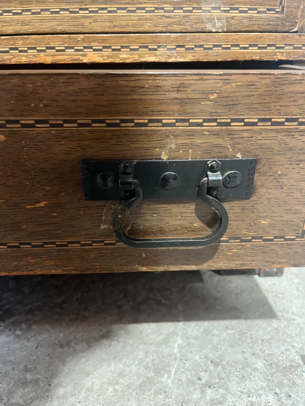 A three-tier oak sectional Globe Wernicke bookcase featuring leaded glass up-and-over doors, inlaid decorative banding, and a single bottom drawer. View VIII
