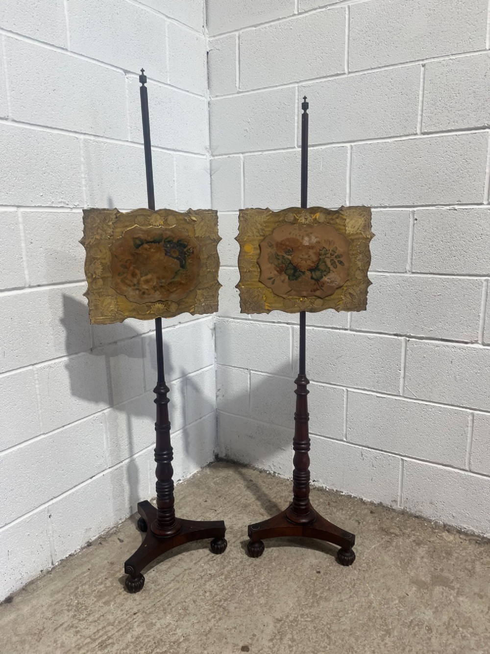A Pair Of Antique Regency Mahogany Pole Screens