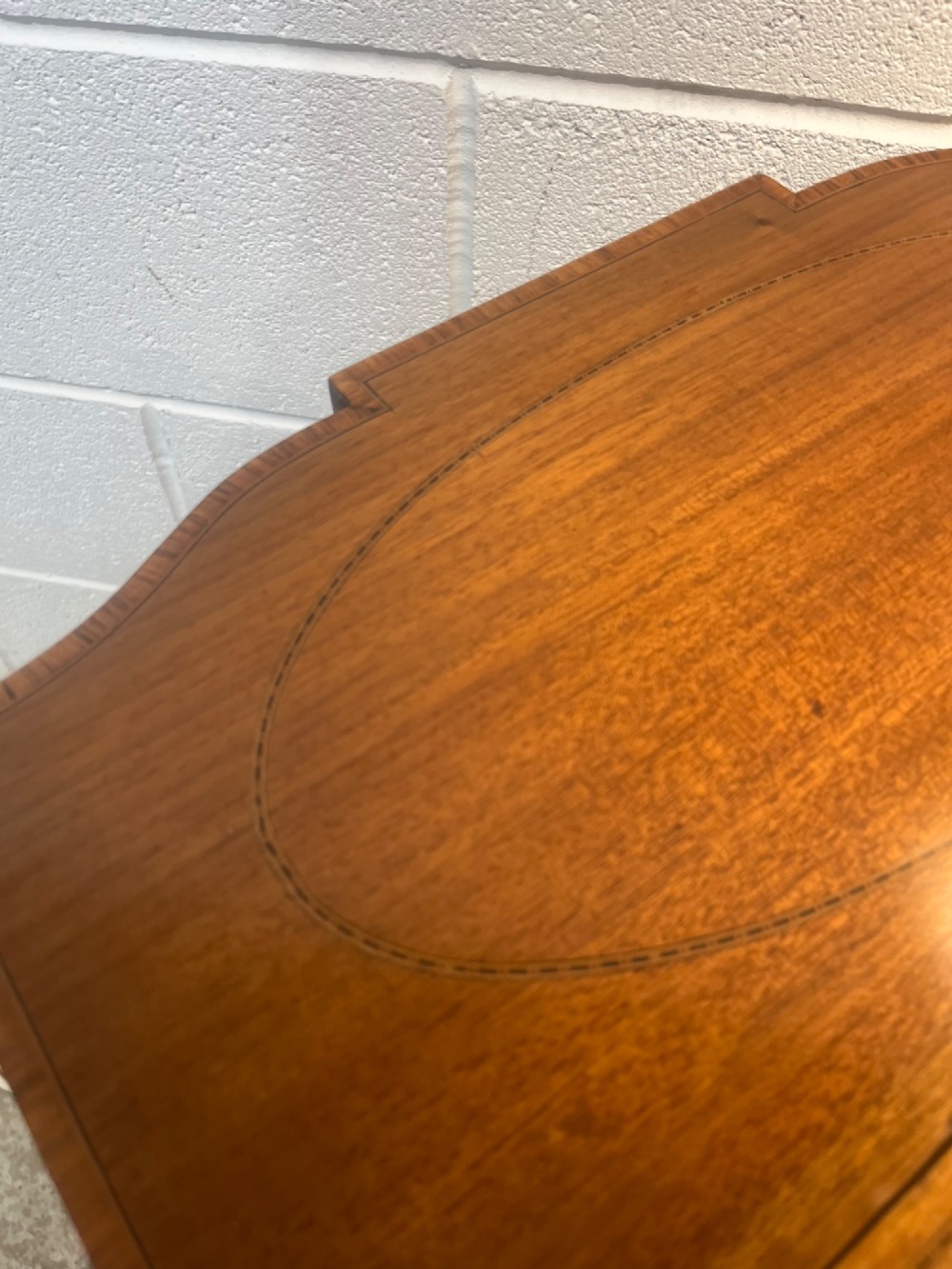A 19th-century mahogany side table featuring two hinged drop leaves, a single frieze drawer with dual brass ring handles, boxwood line inlay, and four square tapered legs. View XIV