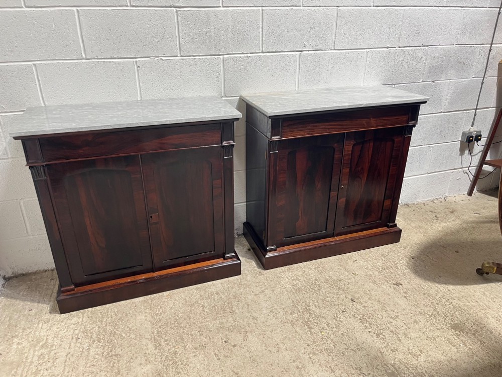 A pair of 19th-century rosewood cupboards featuring dark figured wood grain, double panelled doors, and grey marble tops. View VI