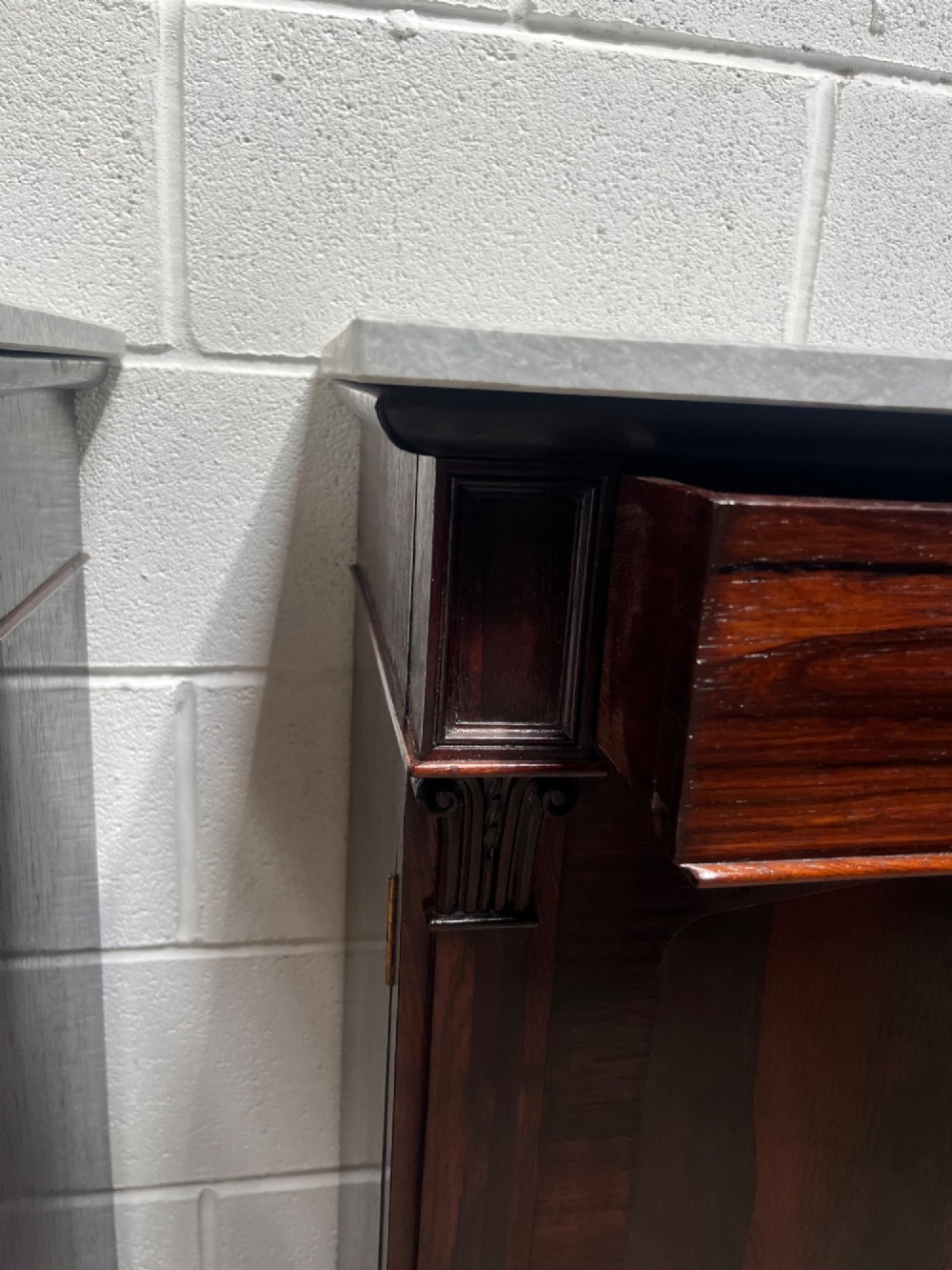 A pair of 19th-century rosewood cupboards featuring dark figured wood grain, double panelled doors, and grey marble tops. View IX