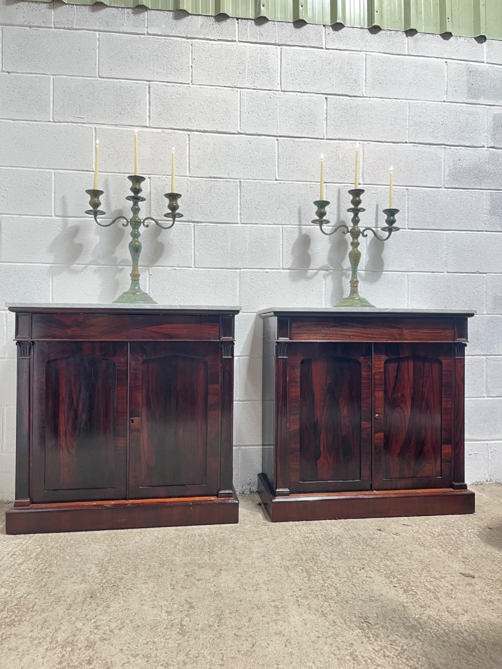 A pair of 19th-century rosewood cupboards featuring dark figured wood grain, double panelled doors, and grey marble tops. View XIII
