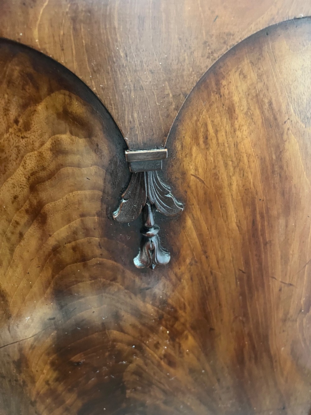 A 19th-century mahogany cupboard featuring twin arched panel doors, flattened bun feet, and a fitted white marble top. View IX
