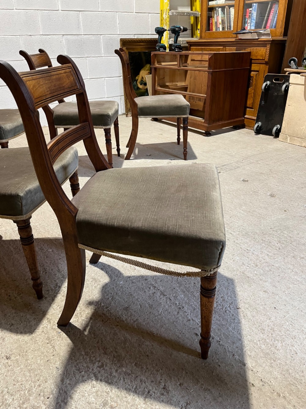 Set of six Regency mahogany dining chairs featuring horizontal bar backrests, green velvet seats, turned front legs, and splayed rear legs. View VIII