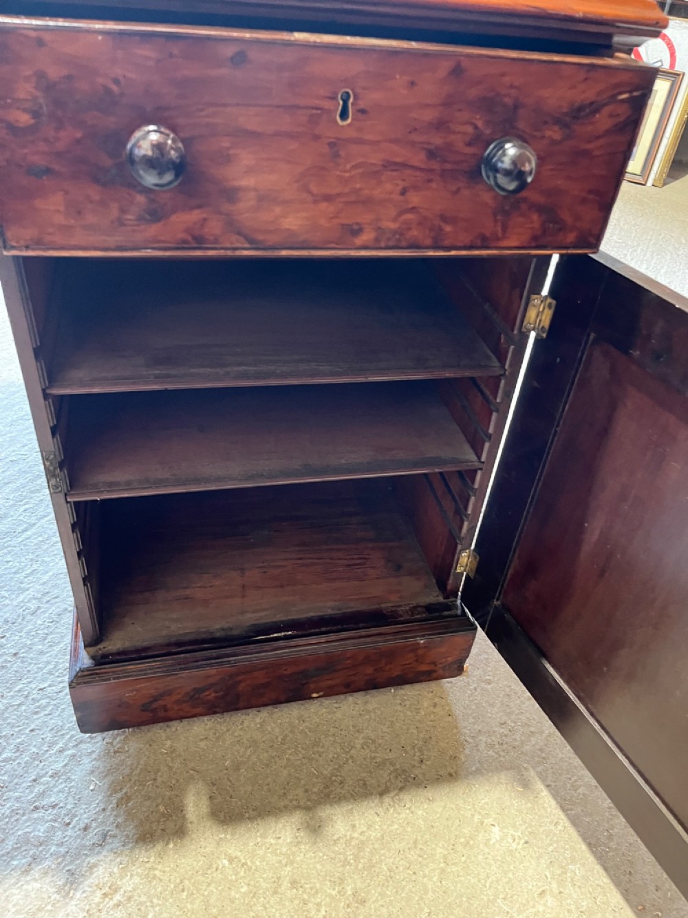 A nineteenth-century Victorian burr walnut pedestal desk featuring a green leather writing surface, multiple drawers with turned wooden handles, and a plinth base. View VIII