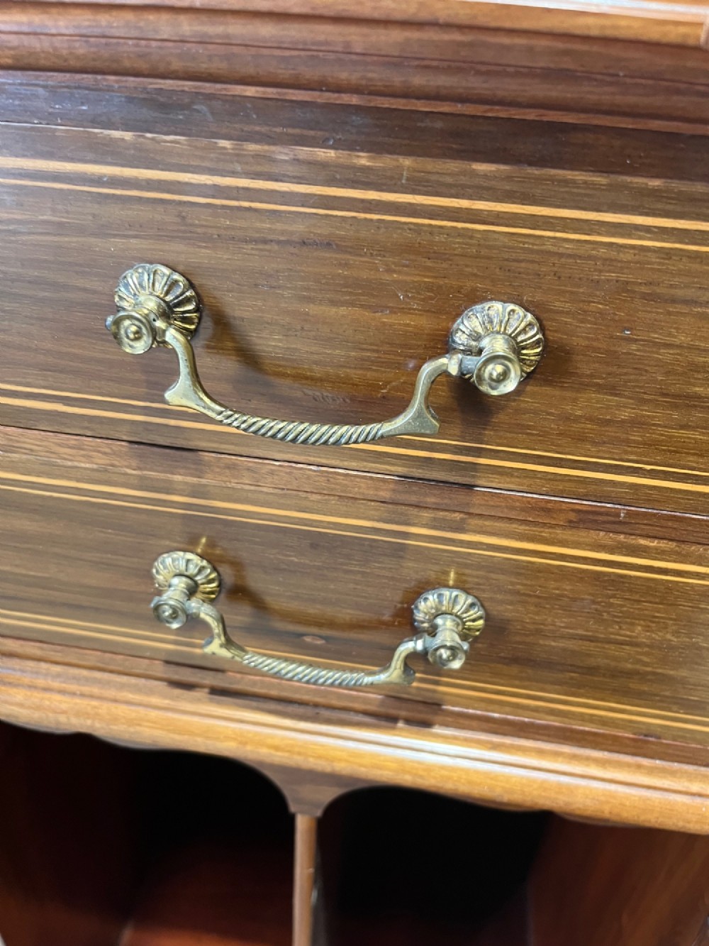 A late 19th-century inlaid mahogany cabinet featuring a grey marble surface, four drawers with string inlay and brass drop handles, above four vertical open storage divisions. View XII