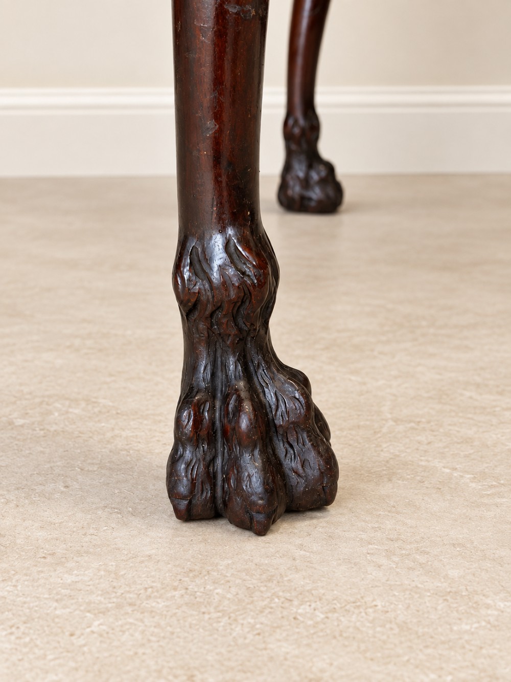A dark mahogany writing table featuring three drawers, a carved shell apron, and cabriole legs with ball-and-claw feet. View IX