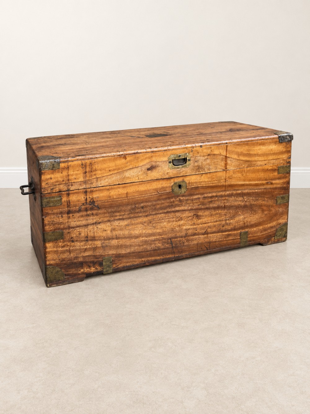 A 19th-century rectangular wooden campaign chest featuring protective brass corner brackets, flush carrying handles, and a hinged lid. View II
