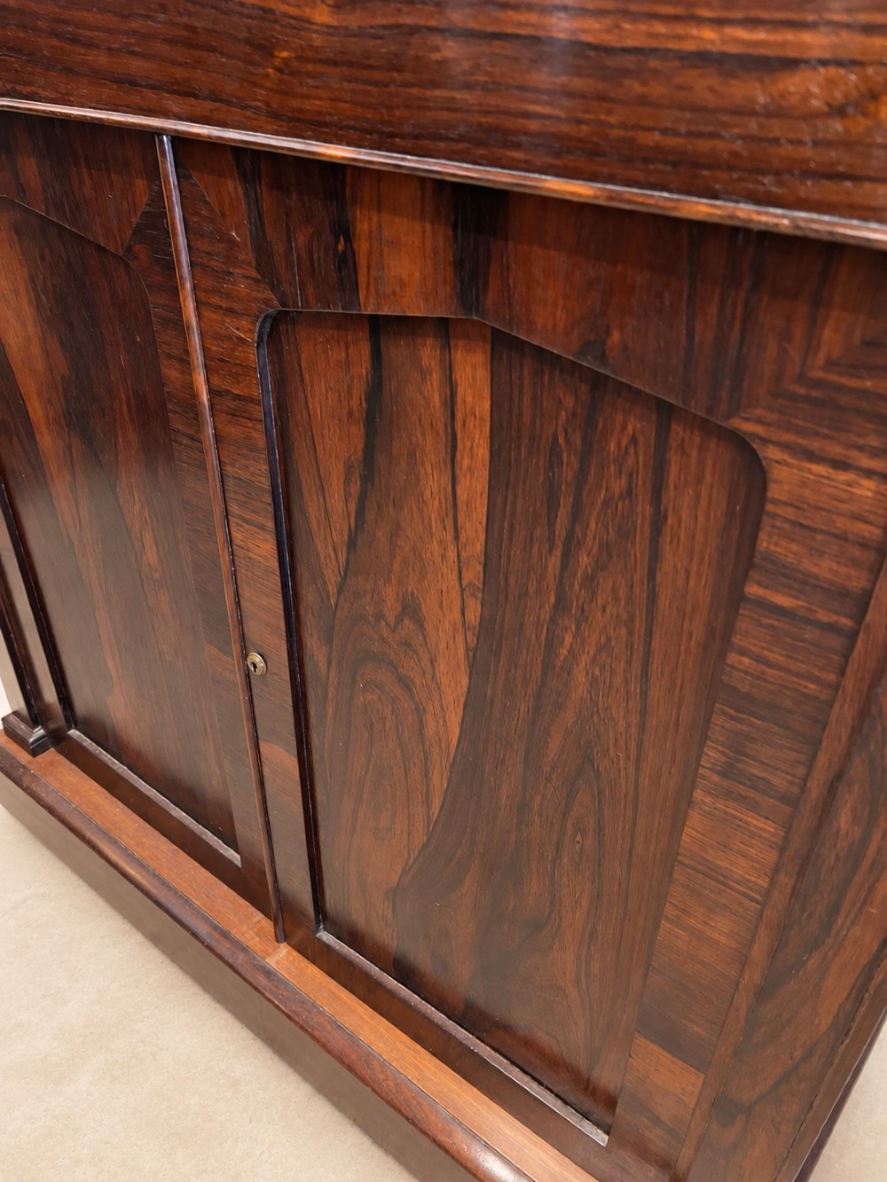 A pair of 19th-century Regency dark rosewood cupboards featuring white marble tops and panelled double doors on plinth bases. View VI