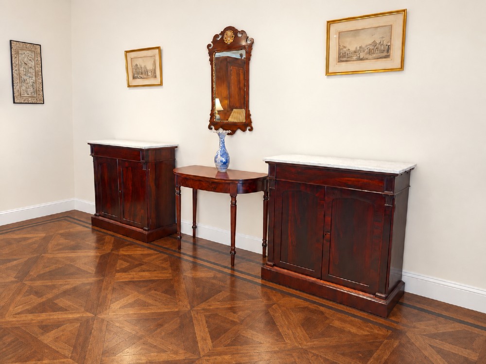 A pair of 19th-century Regency dark rosewood cupboards featuring white marble tops and panelled double doors on plinth bases. View XII
