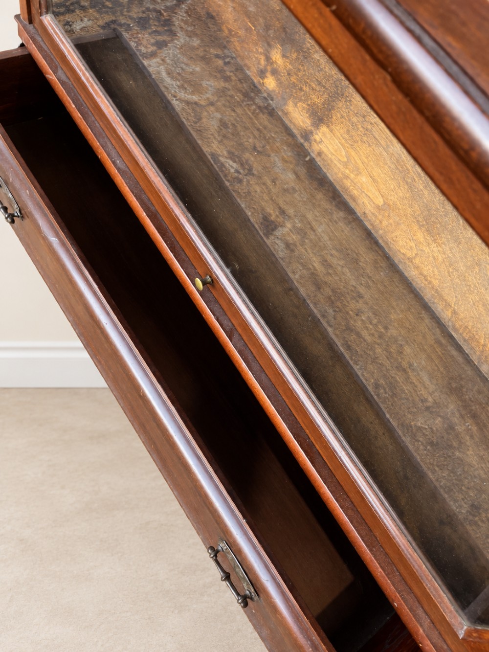 A four-tier dark mahogany Globe Wernicke sectional bookcase featuring glazed lift-up doors and a bottom drawer with brass handles. View VIII