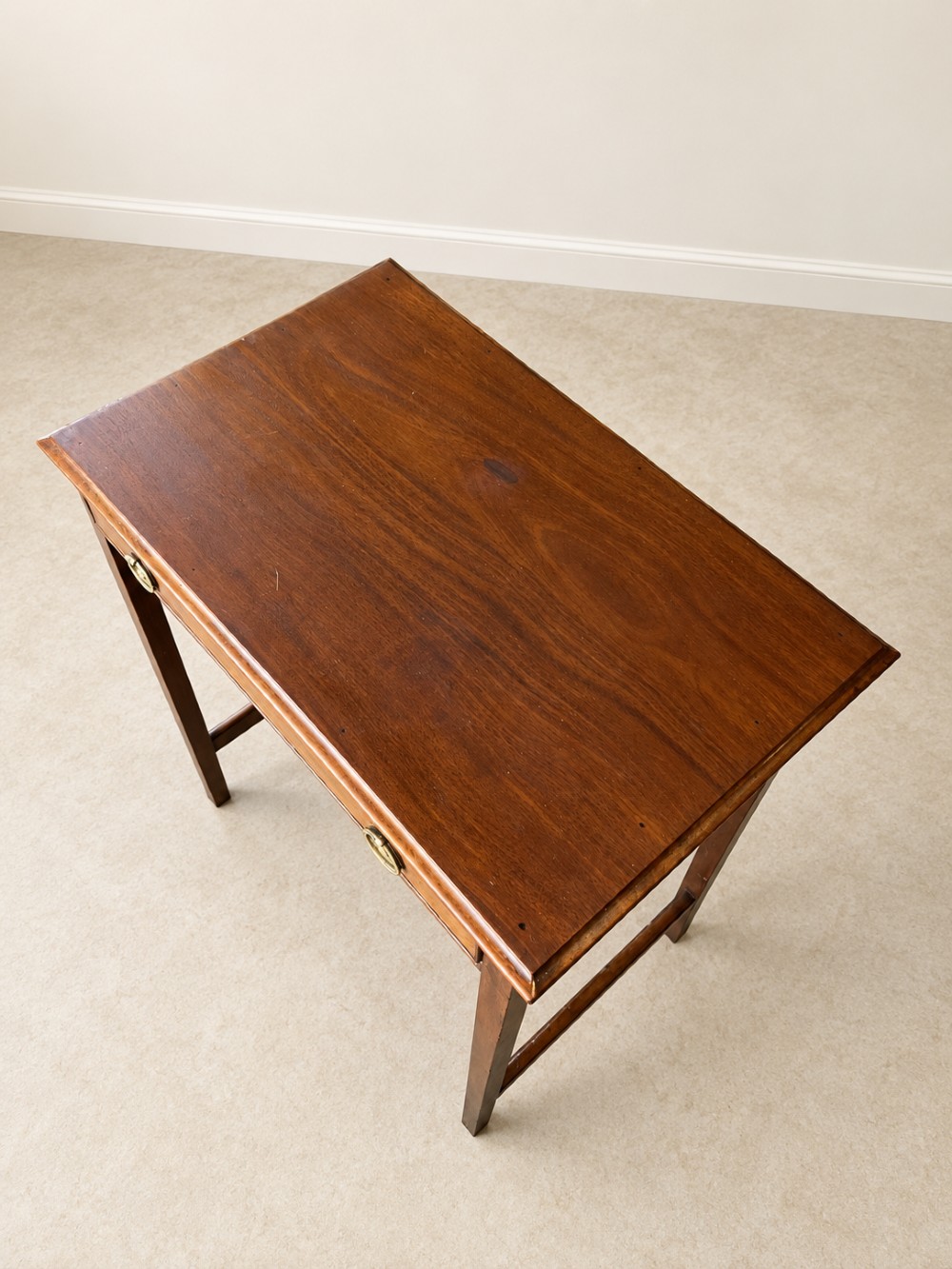 A 19th-century mahogany side table featuring a single drawer with twin brass ring drop handles and straight legs joined by low stretchers. View III