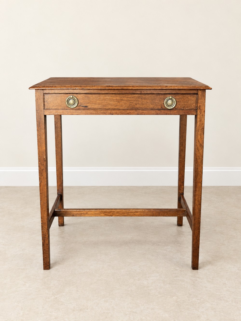 A 19th-century mahogany side table featuring a single drawer with twin brass ring drop handles and straight legs joined by low stretchers. View IV