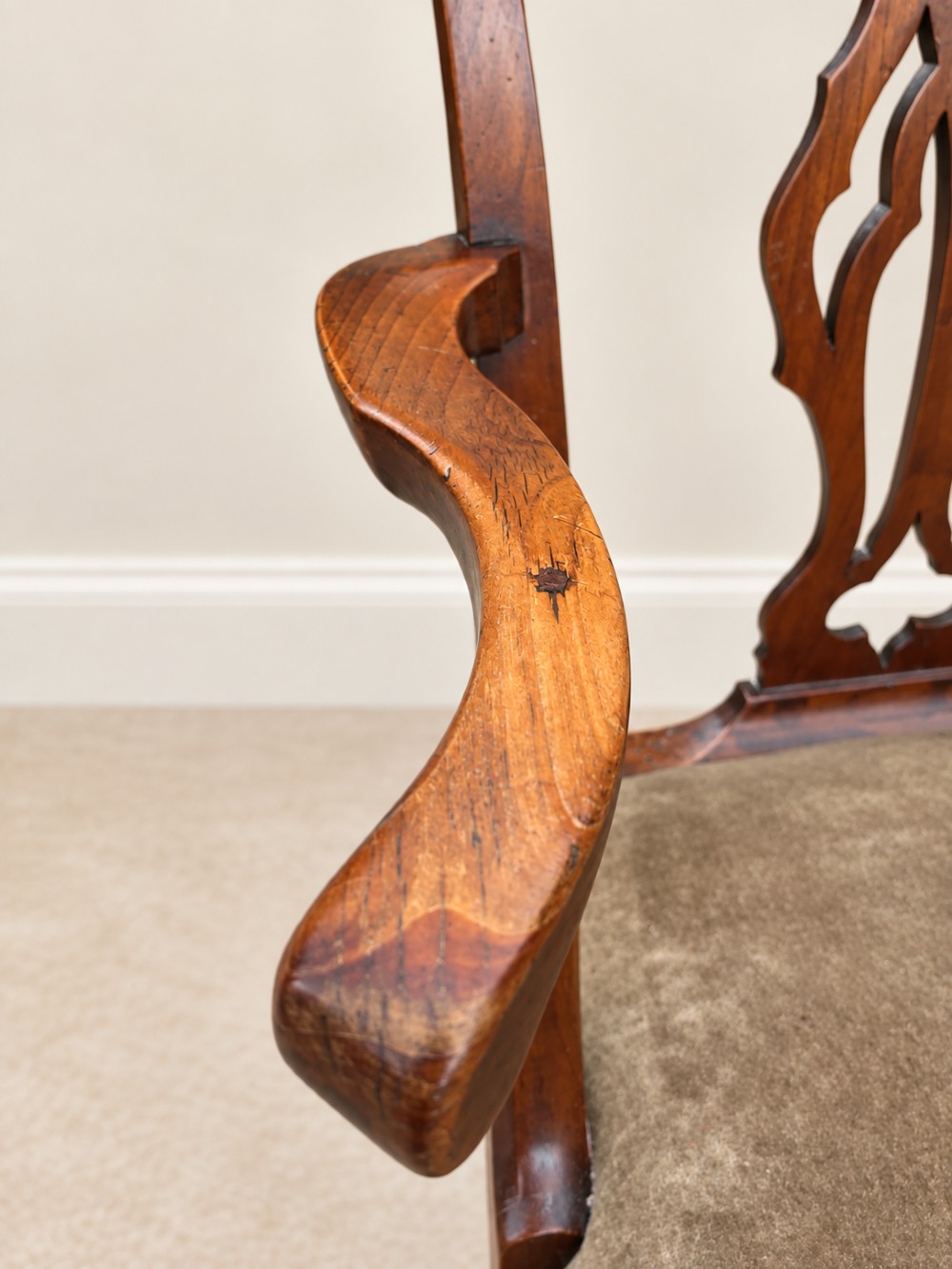 A Georgian yew wood armchair featuring a pierced back splat, curved arms, square legs with stretchers, and a neutral velvet upholstered seat. View VI