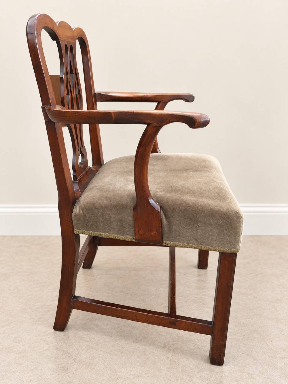 A Georgian yew wood armchair featuring a pierced back splat, curved arms, square legs with stretchers, and a neutral velvet upholstered seat. View VII